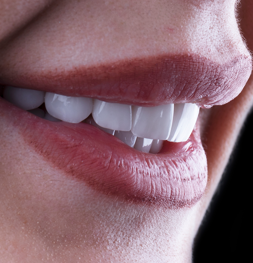 Side profile of a woman smiling